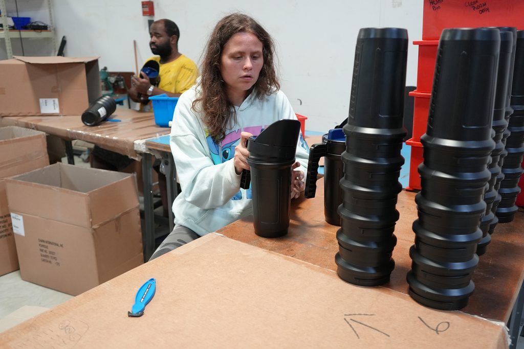 ArcWorks employees working on an assembly project: Chapin International Salt Shakers. 