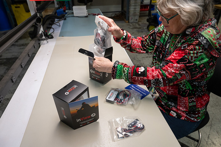 ArcWorks employee completing a project involving kitting and assembly.